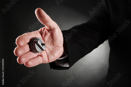Photography Businessman's hand with a hand buzzer