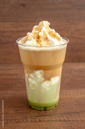 Obraz na płótnie Matcha and espresso frappe in the plastic glass on wooden background w salonie