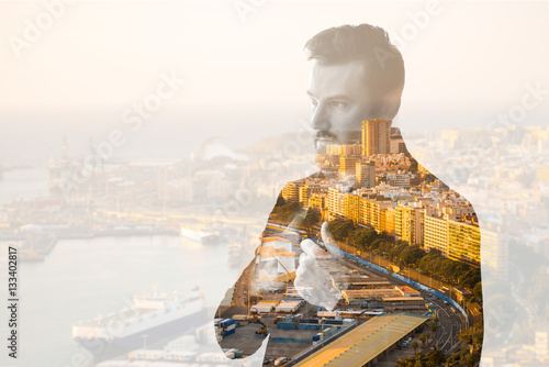 Vászonkép Double exposure portrait of a businessman combinated with spanish city backgroun