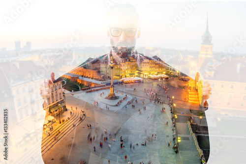 Double exposure portrait of a businessman combinated with Warsaw old town background photo