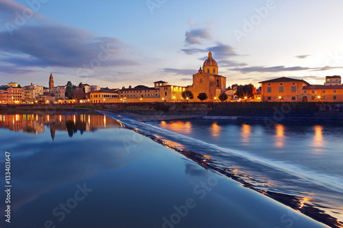 By night beautiful view of Arno river with Archdiocesan Seminary bell tower, Firenze, Tuscany, Italy