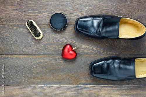 Top view heart shape with men's shoes and accessories shoe care