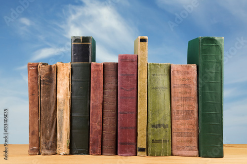 stack of books over the natural background