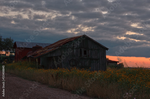 Rustic old farm building at sunset