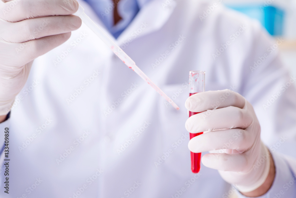 Blood testing in the lab with young scientist Blood testing in the lab with young scientist