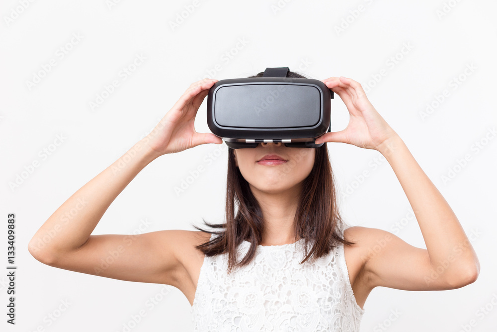 Woman looking though VR device Woman looking though VR device