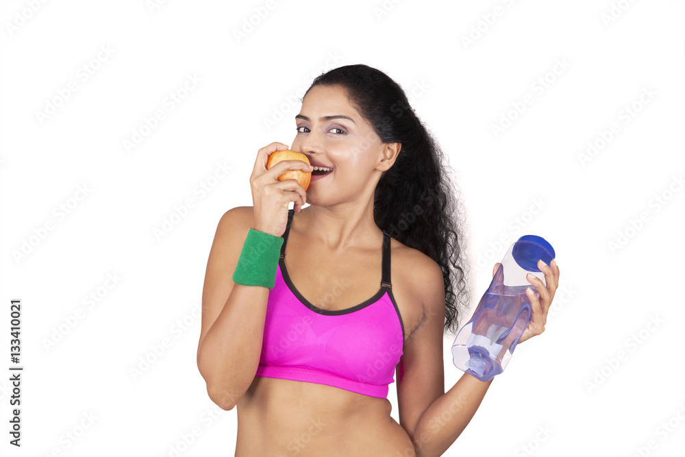 Indian woman eats apple Indian woman eats apple