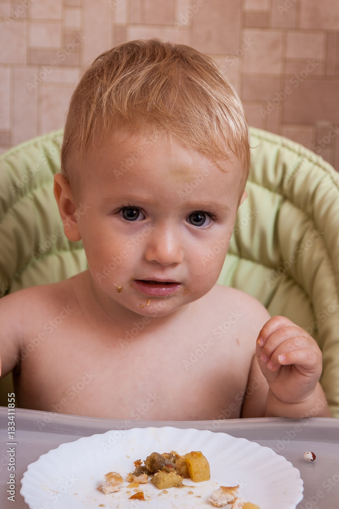 Funny baby for the first time on their own eating adult food Funny baby for the first time on their own eating adult food