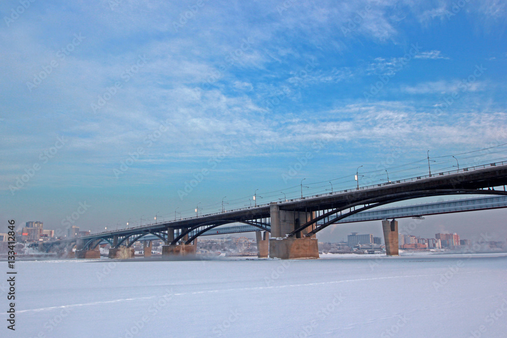 Communal bridge across the Ob River in winter, Novosibirsk. Communal bridge across the Ob River in winter, Novosibirsk.