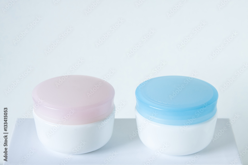 Cosmetic jars mock up , for day and night face care cream. Beauty saloon motif wallpaper. Cosmetic jars mock up , for day and night face care cream. Beauty saloon motif wallpaper.