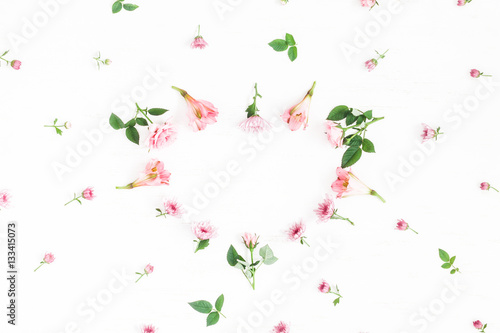 Wallpaper Mural Flowers composition. Heart symbol made of pink flowers and leaves. Top view, flat lay Torontodigital.ca