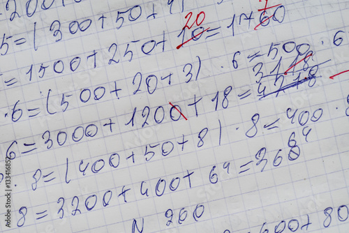 Exercise book of a student with numbers and examples