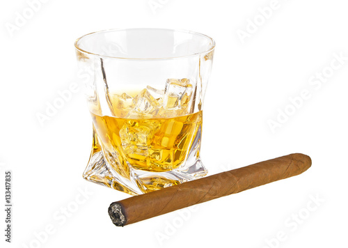 Glass of whiskey with ice and cigar isolated on white background photo