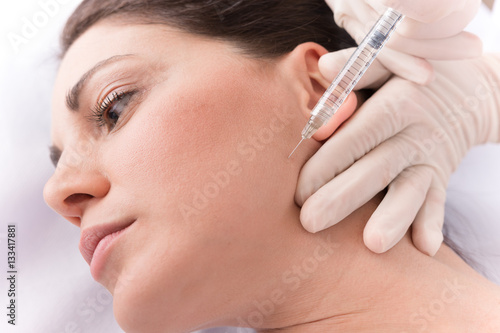 Closeup of beautiful woman receiving hyaluronic acid treatment.