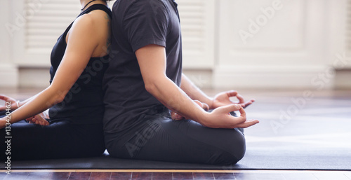 Young couple meditating together