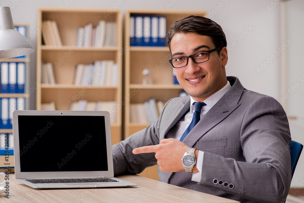 Young handsome businessman working on office Young handsome businessman working on office