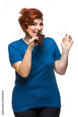 curvy woman eating chocolate