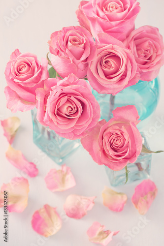 Close-up floral composition with a pink roses.Many beautiful fresh pink roses on a table. 