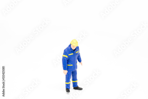 Miniature people worker construction concept on white background