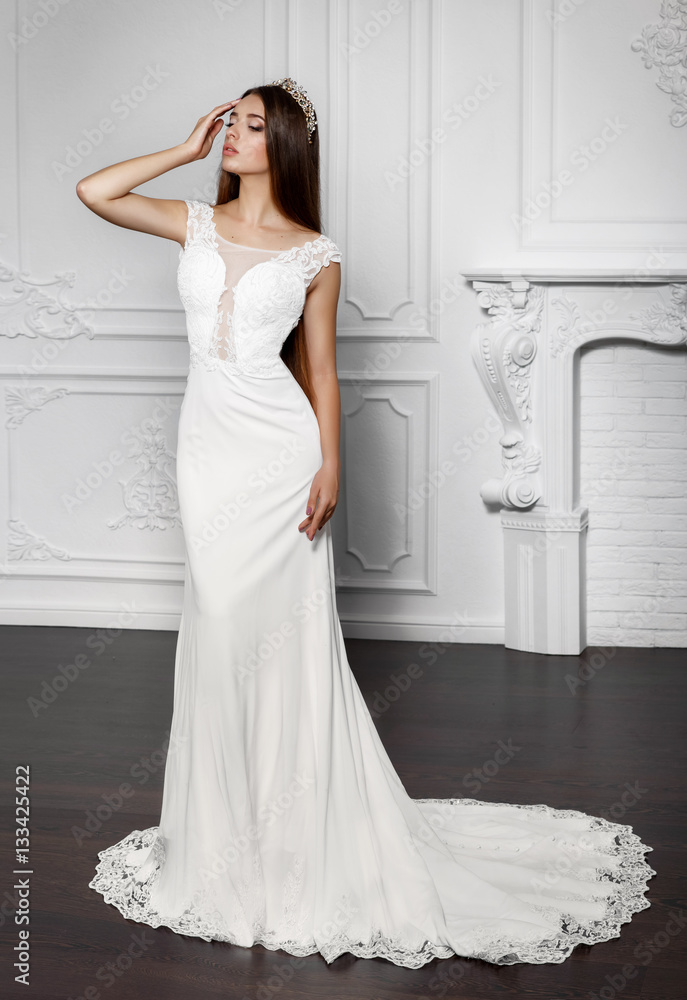 Fashion bride in luxury wedding dress amd diamond jewelry at studio Fashion bride in luxury wedding dress amd diamond jewelry at studio