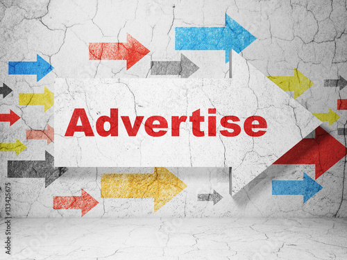 Advertising concept  arrow with Advertise on grunge wall background