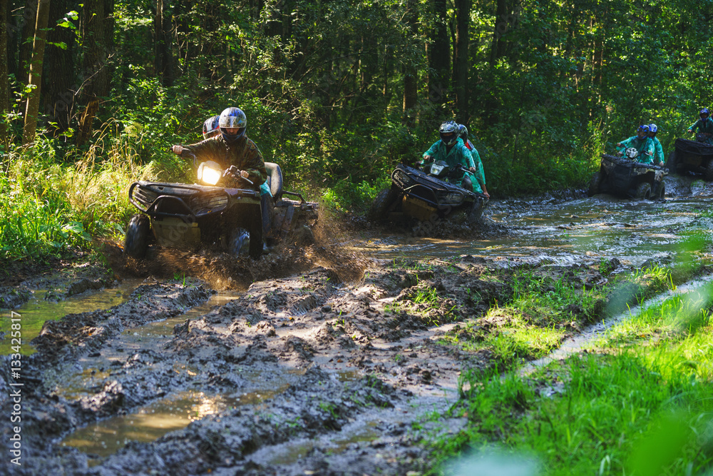 Summer Activities for adults - a trip on quad bikes on the dirty road. Summer Activities for adults - a trip on quad bikes on the dirty road.