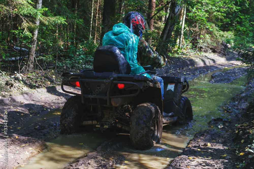 Summer Activities for adults - a trip on quad bikes on the dirty road. Summer Activities for adults - a trip on quad bikes on the dirty road.