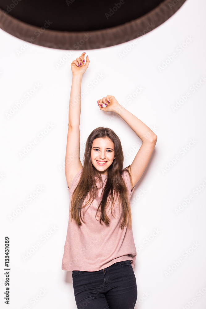 Young beautiful girl with rised hands on white Young beautiful girl with rised hands on white
