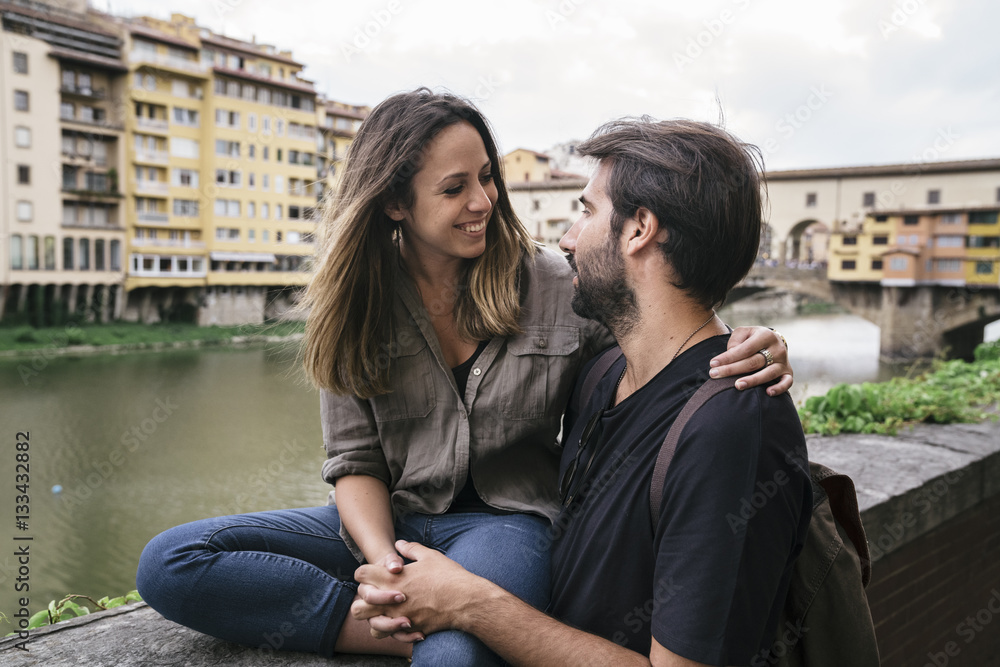 Young couple in love visiting the city of Florence in Italy