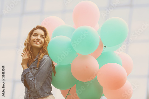 Young woman with colorful b...