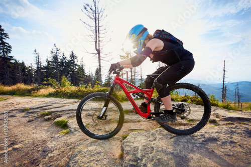 Female mountainbiker riding, biking MTB bike