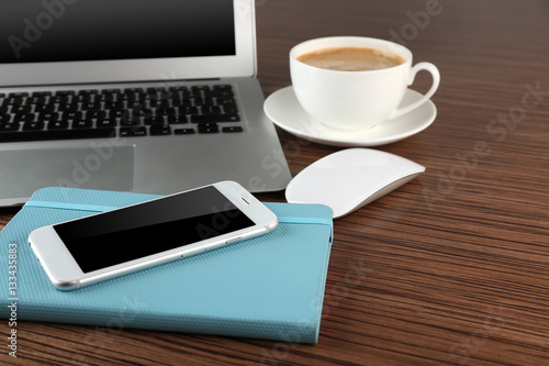 Office desk with coffee and accessories