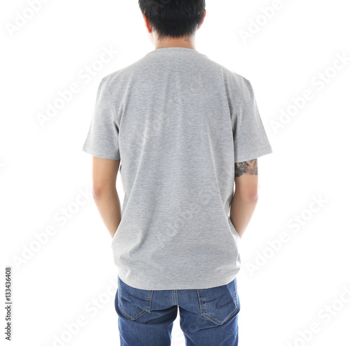 Young man in blank grey t-s...