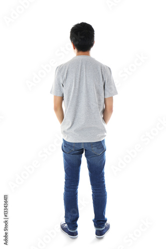 Young man in blank grey t-s...