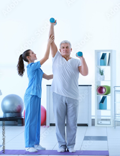Physiotherapist working wit...