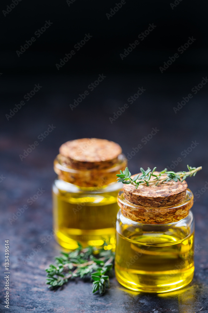 Organic essential thyme oil with green leaves Organic essential thyme oil with green leaves