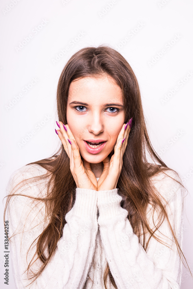 Portrait of young exited fashion girl in white sweater on white Portrait of young exited fashion girl in white sweater on white