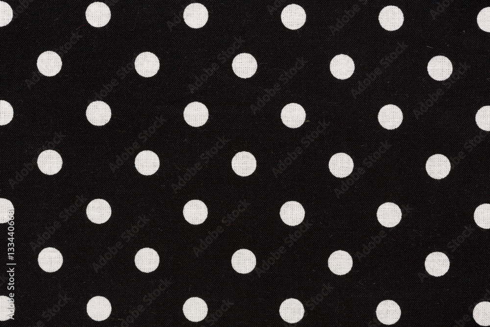 Black and white dots fabric background.