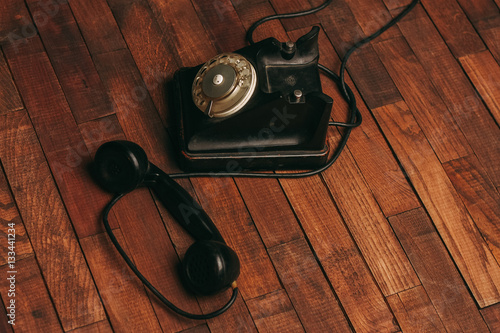 wired phone on a wooden background