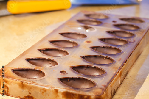 Chocolate-coated cavities in a confectionery mold