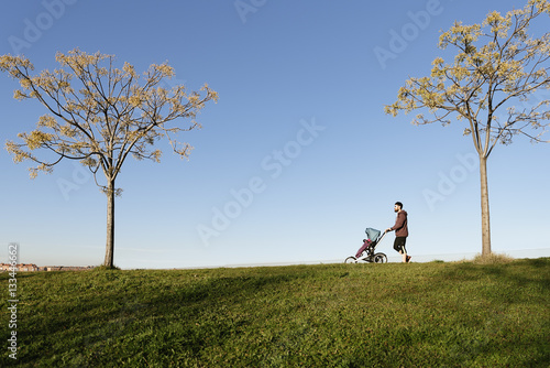 Father playing with his son in the park.