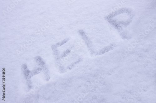 Inscription help on white snow © Azat Valeev
