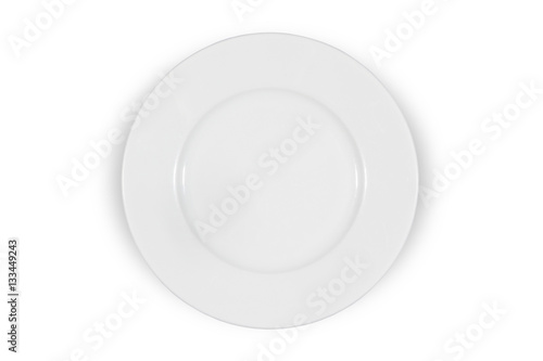 Flat white shallow porcelain plate with wide shoulders on white background directly from above