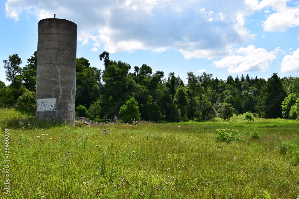 Abandoned silo in a field