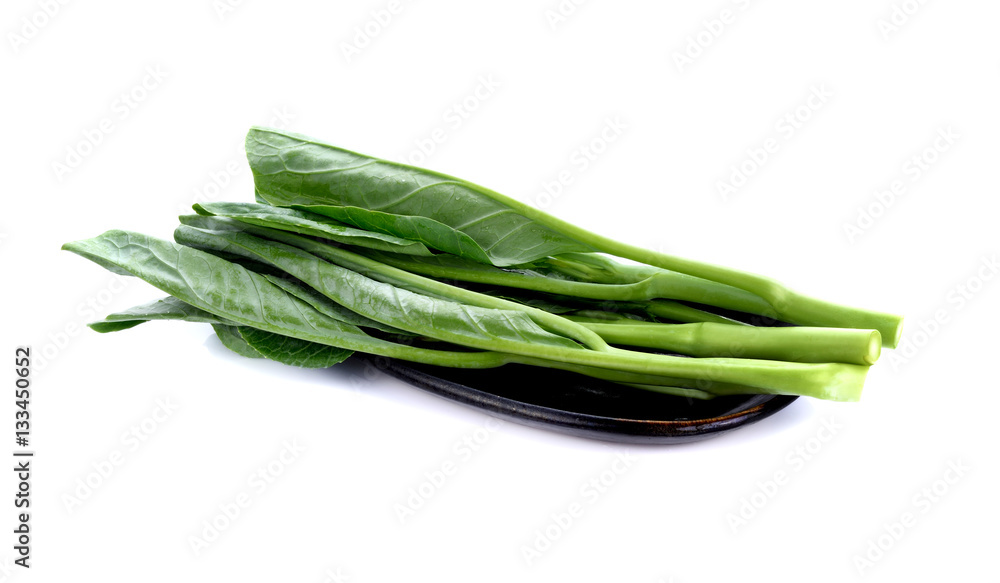 Chinese kale vegetable in brown plate on white background Chinese kale vegetable in brown plate on white background