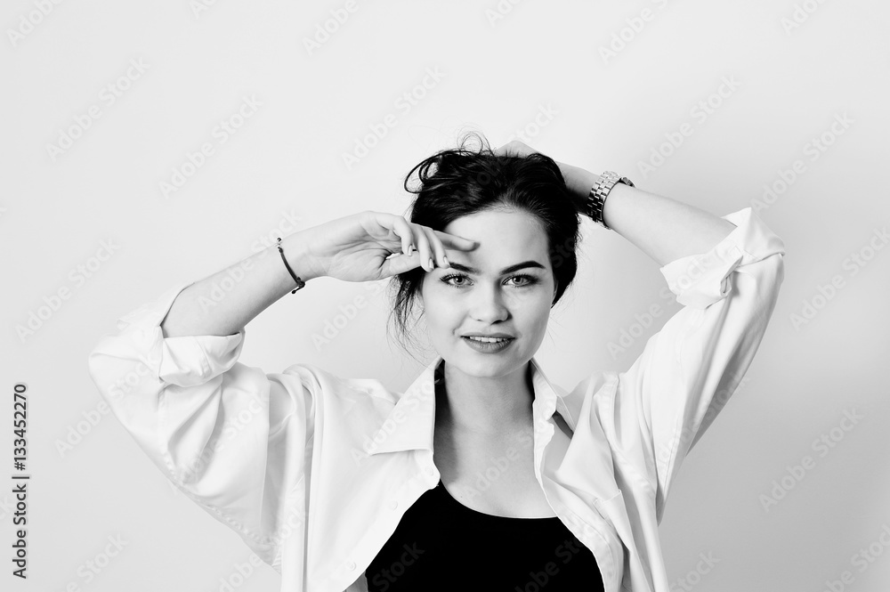 Naklejka premium attractive model is posing in shirt on white background