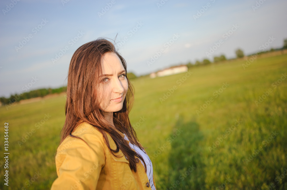 Happy young girl enjoying the beauty of sunny spring day Happy young girl enjoying the beauty of sunny spring day
