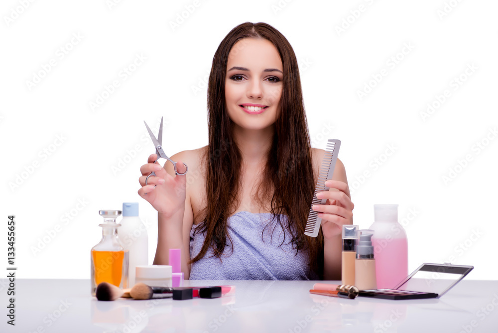 Woman doing hair isolated on white