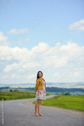 girl standing on asphalt