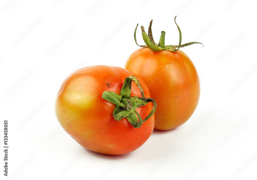fresh tomatoes with green leaves isolated on white background fresh tomatoes with green leaves isolated on white background